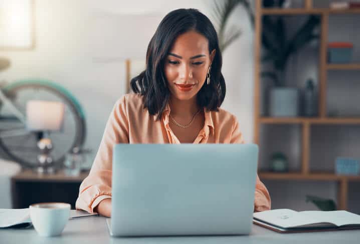 A female cannabis professional in an office after completing her cannabis training