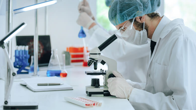 A microbiologist analyzing tests in the laboratory after food safety training