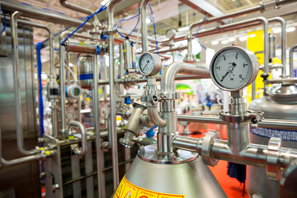 Sophisticated milk pasteurization equipment is used to make yogurt
