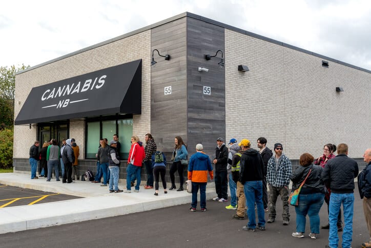 A group of consumers waiting in line to purchase legal cannabis products after receiving cannabis education