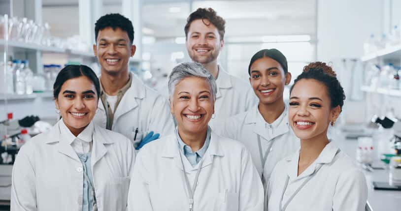 A team of pharma QA professionals in a laboratory setting