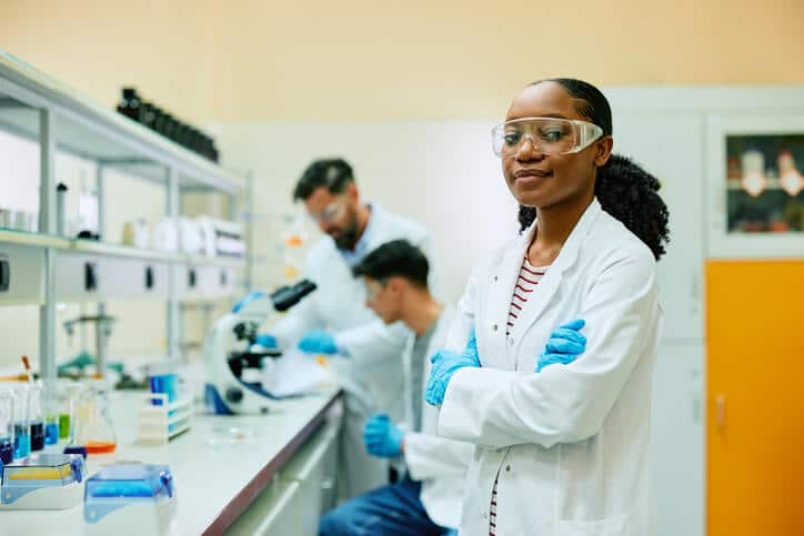 A female quality assurance Associate monitoring lab work after her quality assurance training