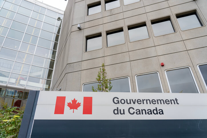 A Government of Canada board outside a clinical research training building